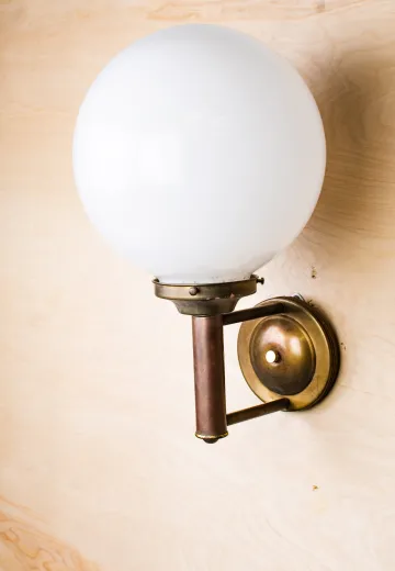 Two Arm One Light Wall Sconce With Frosted Globe Shade